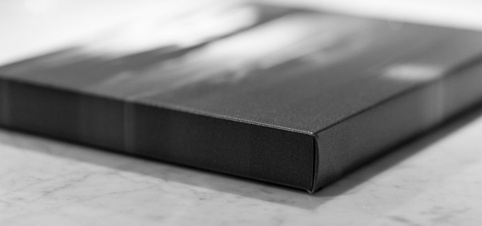 A black and white canvas print showcasing the 1.5" edge depth. 